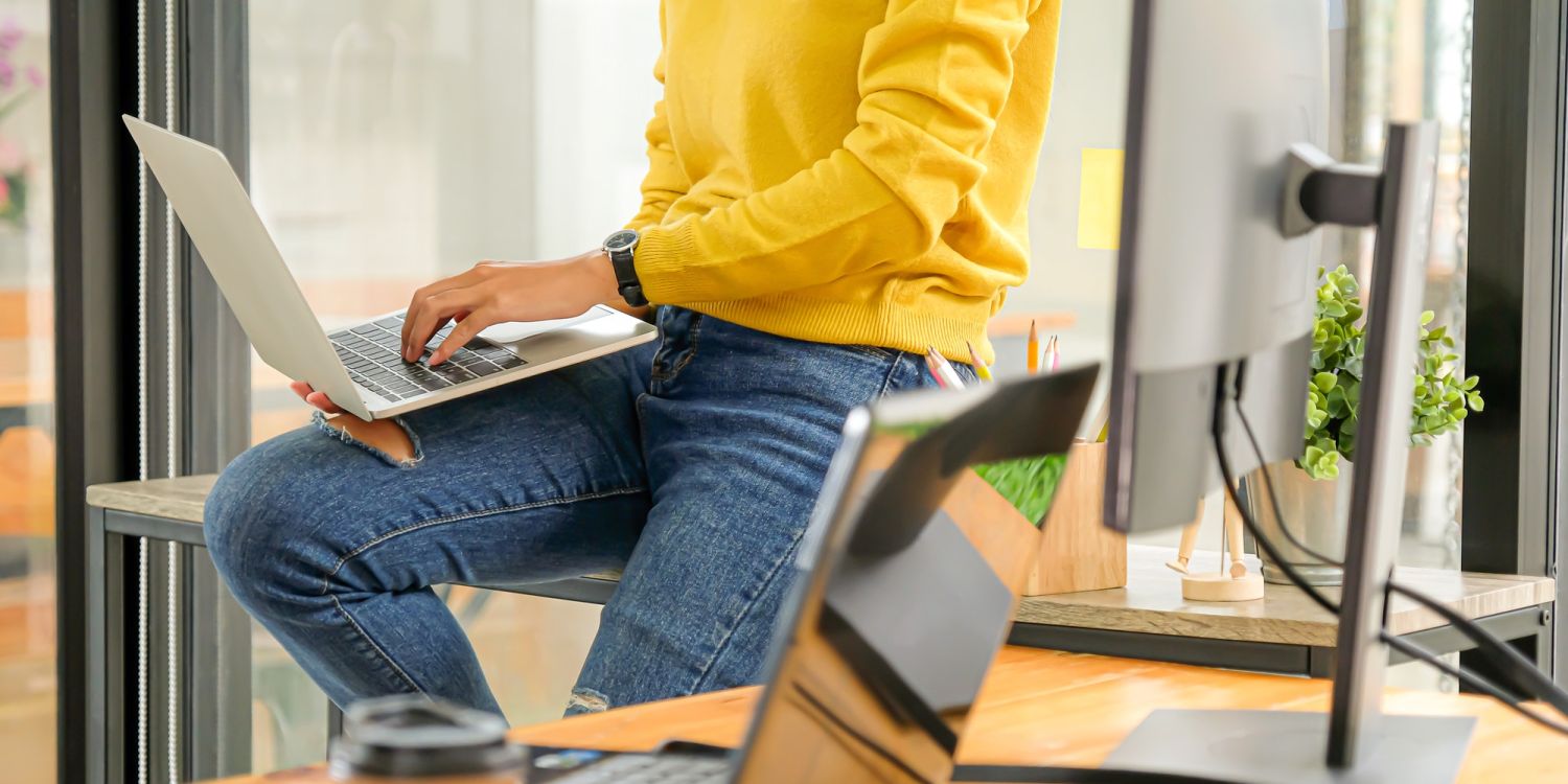 Programmers are using laptops to test the system in the office.